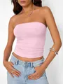 Détail d'un haut bustier rose tendre sur un mannequin, soulignant la coupe et la texture. - XS / Hauts / Rose