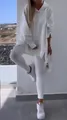 White sports casual two-piece set featuring a hooded slit sweatshirt and matching leggings - S / White
