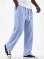 Close-up of men's light blue linen drawstring pants showing texture and straight leg cut - Sky Blue