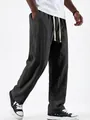Detailed view of men's solid color straight-leg drawstring linen casual pants in charcoal - S / Bottoms / Black