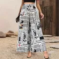 Stylish high-waist wide-leg pants featuring a vintage black and white newspaper print. - S / Bottoms / White