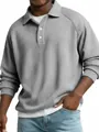 Macro view showing the waffle knit texture of a grey long-sleeve raglan polo shirt - S / Tops / Gray