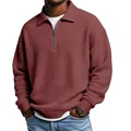 Close-up of men's waffle knit half-zip polo shirt in maroon with lapel collar - Red
