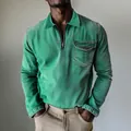 Close-up detail of a green long-sleeved denim shirt featuring a half-zipper and chest pocket - Green