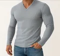 Close-up detail of a men's light blue long-sleeved T-shirt with ribbed texture and V-neck - S / Tops / Gray