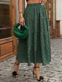 Elegant green floral tiered maxi skirt featuring a clover print and elastic high waist for women - S / Bottoms / Dark Green