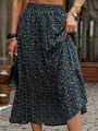 Detailed macro view of navy blue floral tiered maxi skirt with vintage pleats - Navy Blue