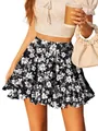 Detail showing the intricate floral print and ruffled hem of this high waist skater skirt - S / Bottoms / Black Floral