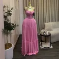 Elegant pink pleated maxi dress with spaghetti straps and high waist on a mannequin - S / Dresses / Pink