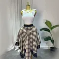 High-waisted brown plaid asymmetrical A-line skirt with decorative tie-front design - S / Bottoms / Brown Rice Checkered Pattern