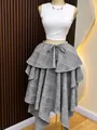 Detail of gray plaid irregular tiered A-line skirt with high waist and tie - Gray