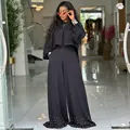 Elegante completo nero due pezzi con top a maniche a lanterna e pantaloni larghi con perle - Taglia S / Top E Pantaloni / Nero