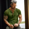 Detailed view of men's olive green Henley shirt with contrast stitching details. - S / Tops / Grass Green