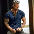 Close-up detail of a men's navy blue henley t-shirt featuring stylish contrast stitching - S / Tops / Dark Blue