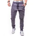 Detail view of men's grey cargo jogger pants with elastic drawstring waist and side pockets - S / Bottoms / Gray