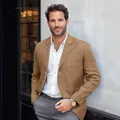 Detailed view of a men's tan linen blazer for casual business styling - S / Tops / Turmeric