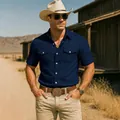 Model wearing navy blue vintage cotton linen cargo shirt in Western outdoor setting - S / Tops / Dark Blue