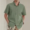Detail view of men's casual stand collar cotton linen short sleeve shirt in sage green - S / Tops / Army Green