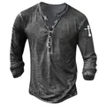 Close-up of men's vintage washed Henley shirt with cross print on sleeve - S / Tops / Dark Gray