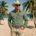 Detailed view of a green cotton linen beach shirt for men worn in a tropical setting. - S / Tops / Army Green