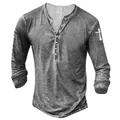 Close-up of men's Henley shirt with acid wash texture and white cross print on sleeve - S / Tops / Light Gray