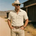 Professional lifestyle shot of a men's retro beige cotton linen short-sleeved shirt - S / Tops / Khaki