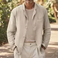 Detail view of a men's beige linen casual blazer worn by a model in an outdoor setting - S / Tops / Off White