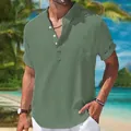 Detailed view of men's olive green linen cotton short sleeve Henley shirt in a beach setting. - Army Green