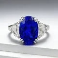Close-up of S925 silver ring with 8x12mm cobalt blue oval stone and side crystals - Size 5 / Three-Stone Inlay Style (R1699) / Cobalt Blue (R1699)
