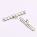 Detailed view of silver alloy bar buttons with high-foot loop for sewing - 25mm Length / Silver