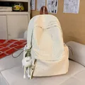Elegant cream checkered school backpack for girls featuring a cute fluffy monster charm - With Charm / Beige