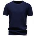 Macro view of the textured navy blue knit fabric on a men's crew neck T-shirt - S / Tops / Navy Blue