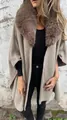 Detail view of a women's taupe poncho coat featuring a plush faux fur collar and textured fabric - Khaki