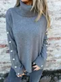 Detailed view of a gray turtleneck knit sweater featuring button accents on the long sleeves. - S / Tops / Dark Gray