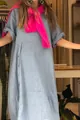 Detail view of a loose light blue cotton linen dress with buttons and pink scarf - Light Blue