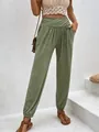 Detail view of high-waisted olive green joggers with cross-waist and side pockets - S / Bottoms / Army Green