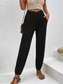 Detail view of black high waisted harem pants with crossover waist and side pockets - S / Bottoms / Black