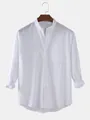 Close-up view of a white cotton linen shirt featuring a stand collar and pocket. - S / Tops / White