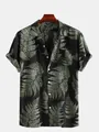 Close-up of men's casual short-sleeve beach shirt with tropical fern leaf print - S / Tops / Black