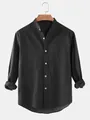 Front view of minimalist black men's shirt with stand collar and pocket detail - S / Tops / Black
