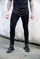 Detailed view of mens black skinny jeans with elastic slim fit and urban streetwear design style - S / Bottoms / Black