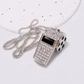 Nahaufnahme einer silberfarbenen mit Strass besetzten Pfeife mit Fußballmotiv - Football Whistle Necklace / Silber