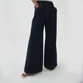 Detailed view of dark blue wide-leg denim pants with elastic drawstring waist for women. - XS / Bottoms / Black