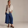 Fashionable women's wide-leg cropped denim jeans featuring an elegant ruffled hem detail - S / Bottoms / Dark Blue
