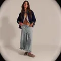 Women's light blue wide leg cropped denim pants featuring a stylish ruffled hem and relaxed fit - S / Bottoms / Light Blue