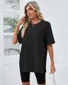 Side view of a loose black T-shirt with side slits and a comfortable round neck - S / Tops / Black