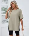 Detail shot of a women's oversized sage green crew neck T-shirt with high side slits - Khaki