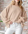 Close-up of beige textured waffle knit oversized long-sleeved top for women - S / Tops / Off White