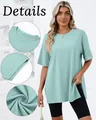 Detail view of mint green loose T-shirt showing neckline, slit and fabric texture - Emerald