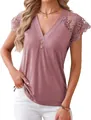 Detailed view of women's V-neck top with intricate lace sleeves and button trim - S / Tops / Peach